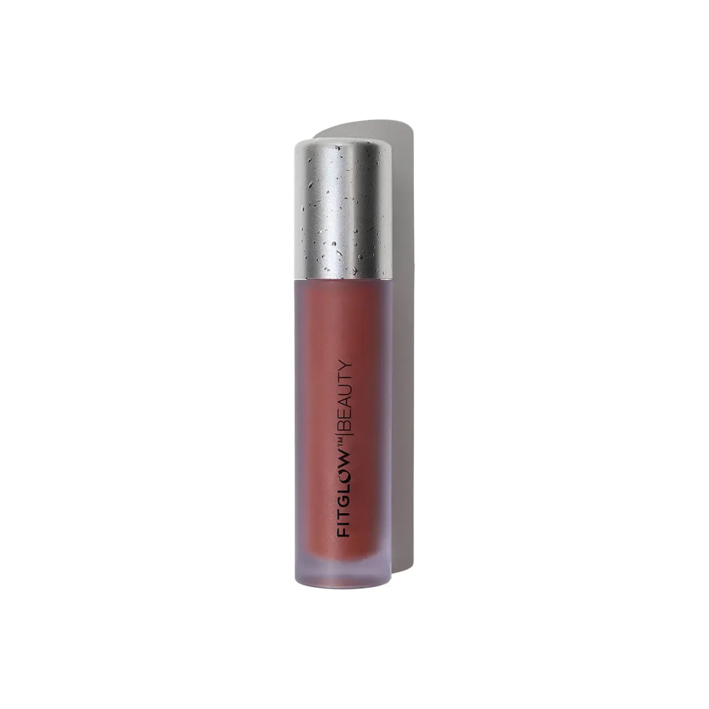 Tube of fitglow beauty lip gloss against a white background.