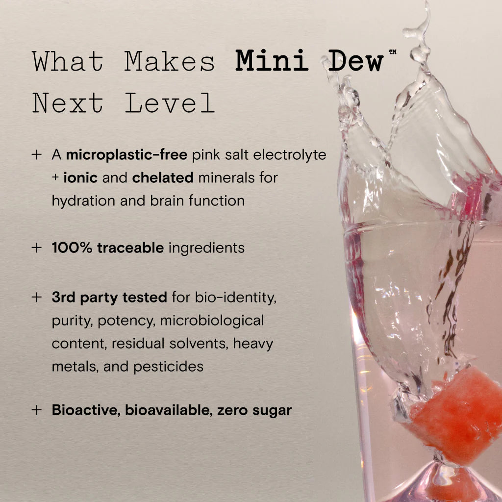 Liquid being poured into a glass containing pink salt, promoting a beverage called mini dew with benefits such as electrolyte infusion and zero sugar.