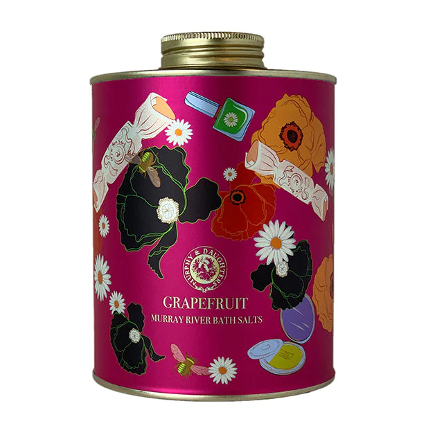 A tin can labeled "grapefruit murray river bath salts" with a floral design on a pink background.