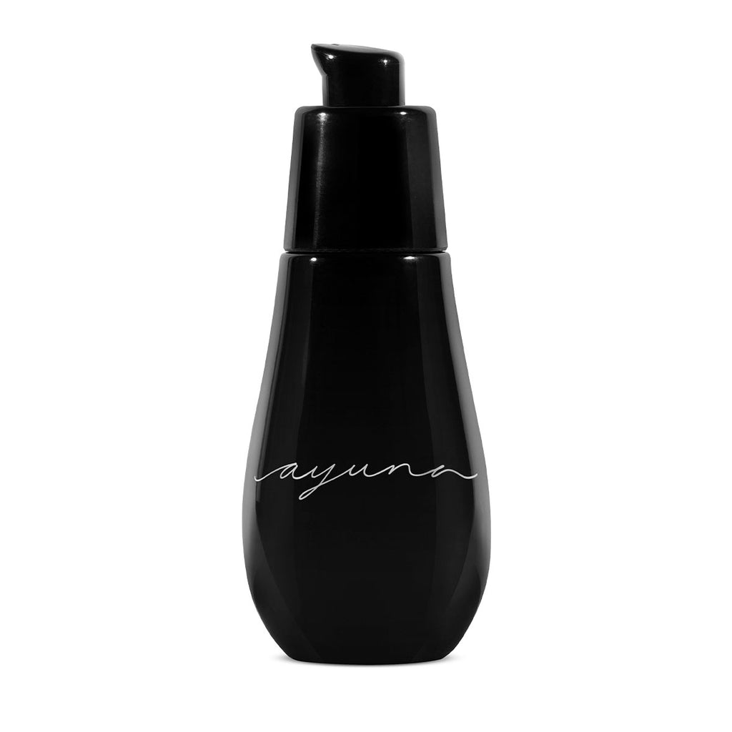 A black cosmetic bottle with the word "layuna" written on it against a white background.