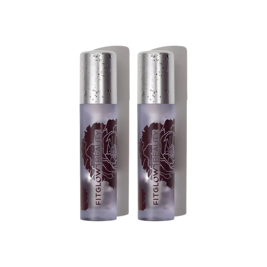 Two bottles of fitglow beauty lipstick against a white background.