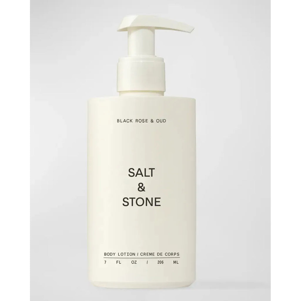 A cream-colored pump bottle labeled "SALT & STONE Body Lotion, black rose & oud, body lotion with niacinamide, 7 fl oz / 207 ml" on a plain background.