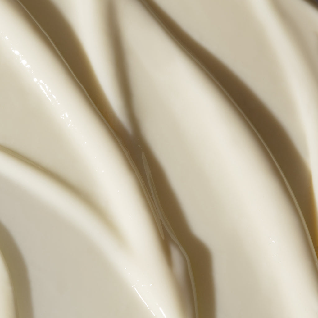 Close-up of creamy white substance with smooth texture.