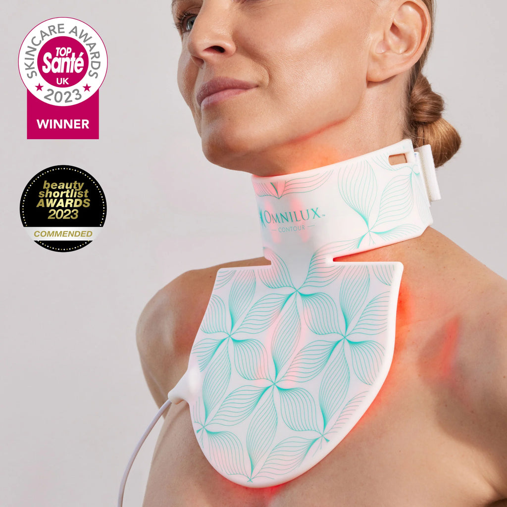 Woman using a light therapy neck device, awarded in skincare innovation.