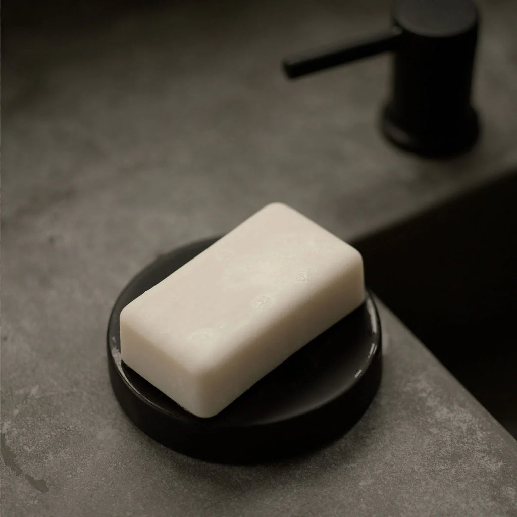 monaco bar soap on a bathroom counter in a soap dish