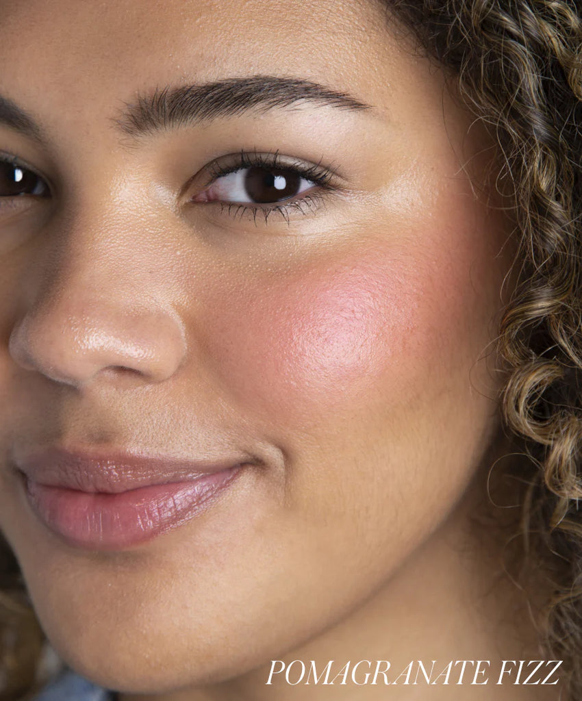 Model wearing shade Pomagranate Fizz