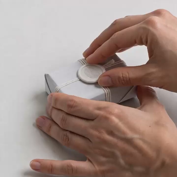 video of a person unwrapping a Costa Brazil Breu soap
