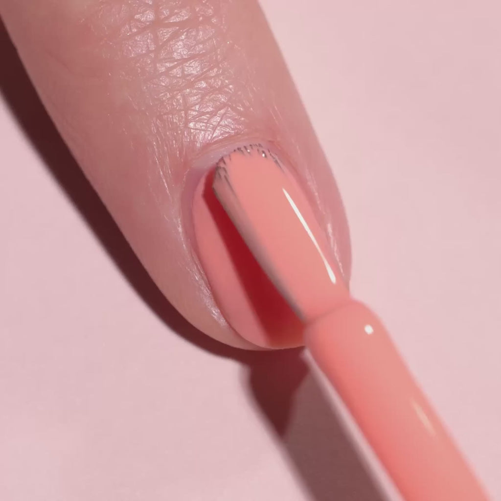 video of someone applying Manucurist "Tangerine" nail polish