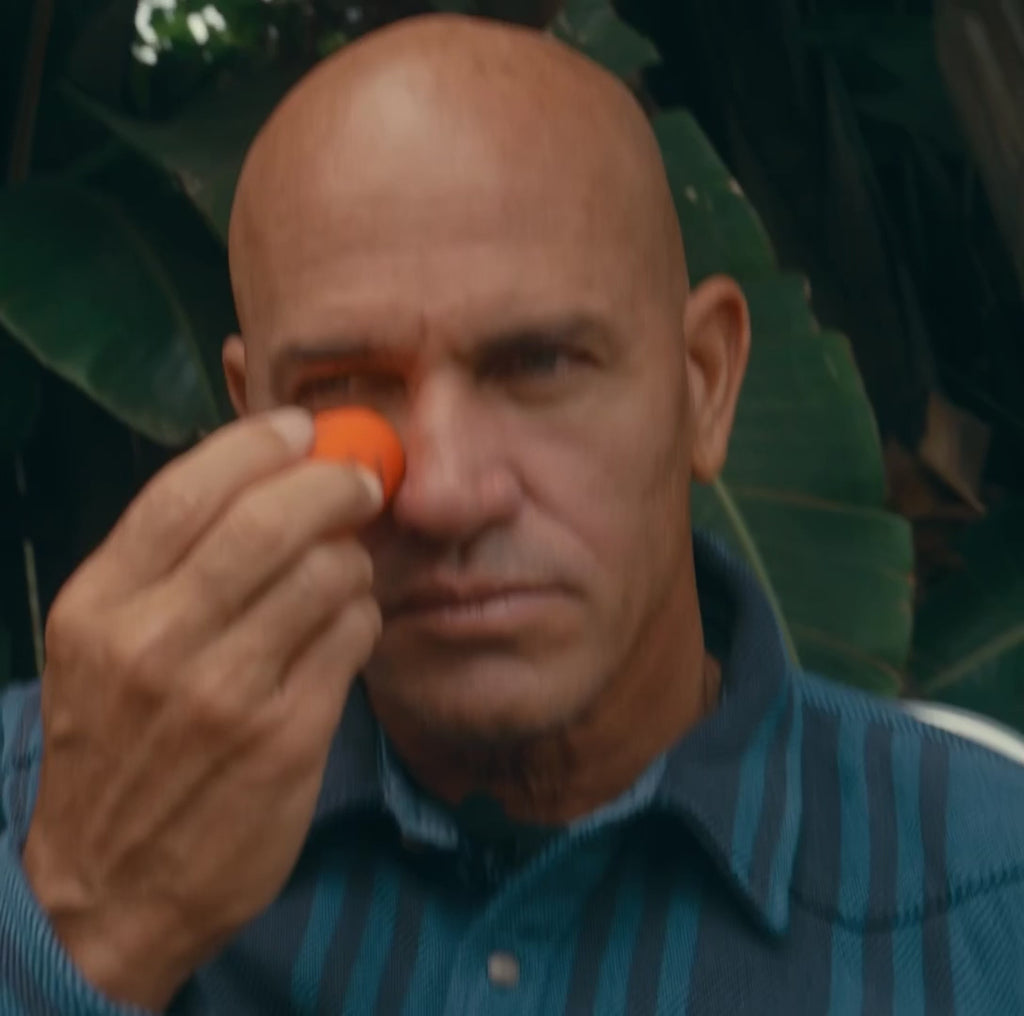 Kelly Slater applying Peak Performance Sun Stick SPF 50