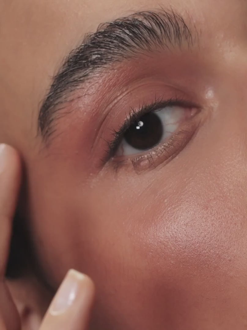 model applying FOXY BROWN 02: The Cream Color Pot VARWE in Brown Ruby 02 is a soft reddish brown that creates warm accents for every skin tone. The soft, creamy, buttery texture with a silky finish hugs the cheeks, eyes and lips.