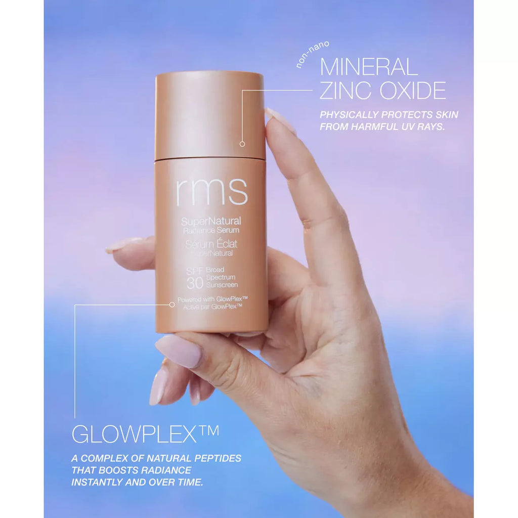 A hand holding a bottle of rms beauty sunscreen with information about its mineral zinc oxide content and benefits against uv rays.