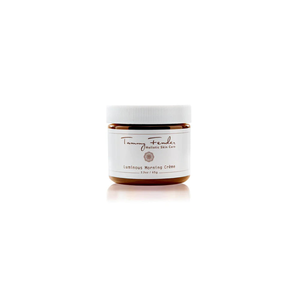 A jar of luminous morning crÃ¨me by tranquility skin care on a white background.