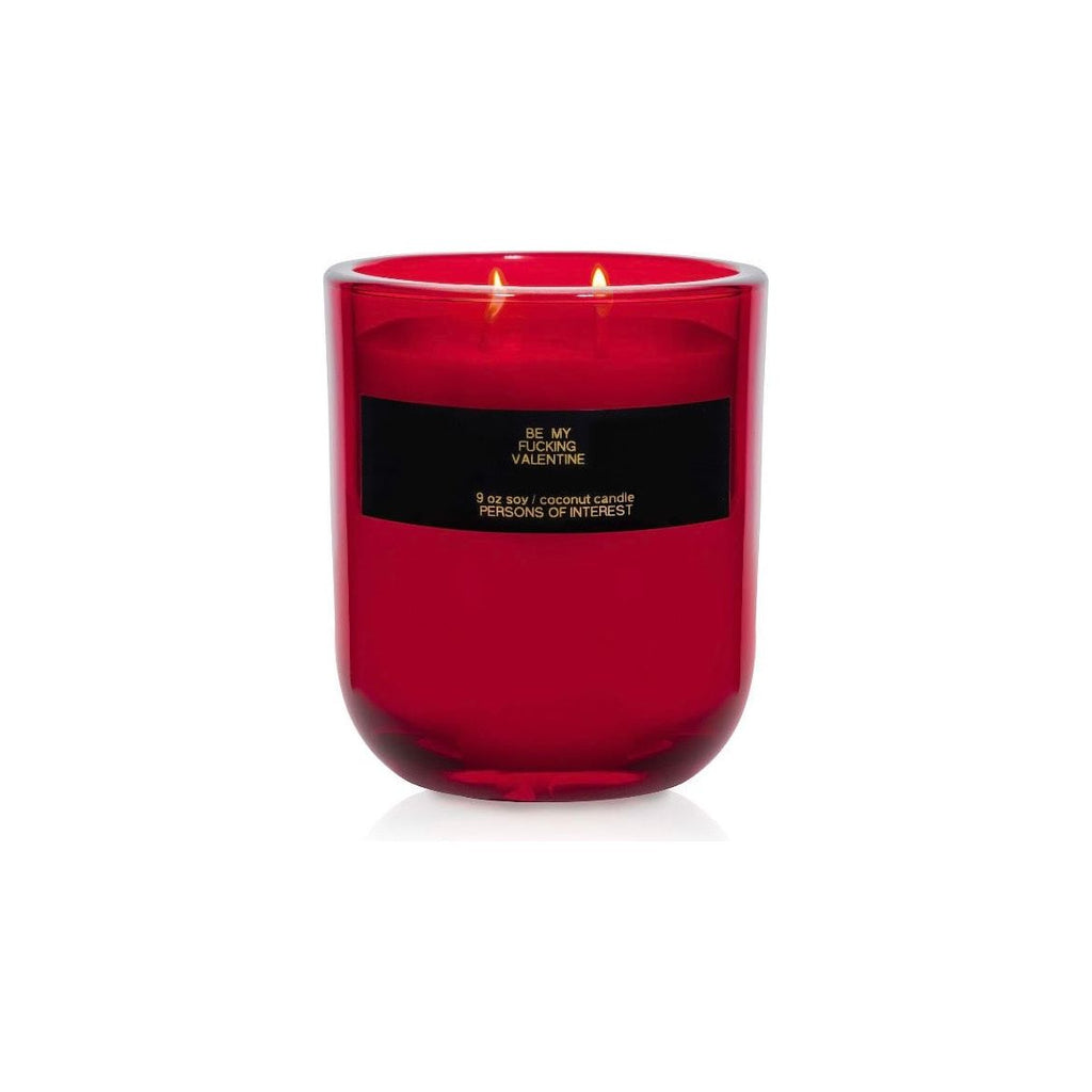 A red scented candle with two wicks lit, labeled "be my valentine.