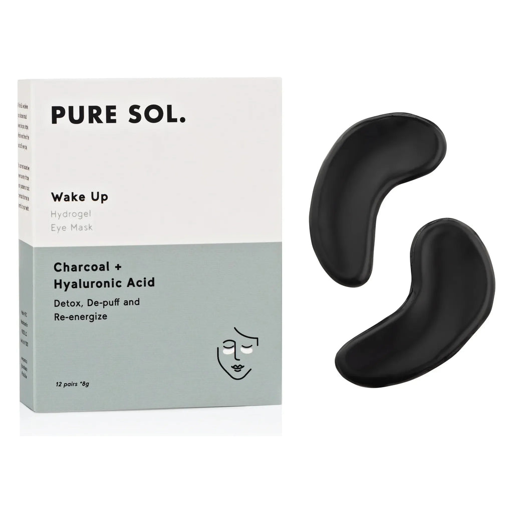 Eyemask package labeled "pure sol. wake up - charcoal + hyaluronic acid" alongside two black under-eye masks.