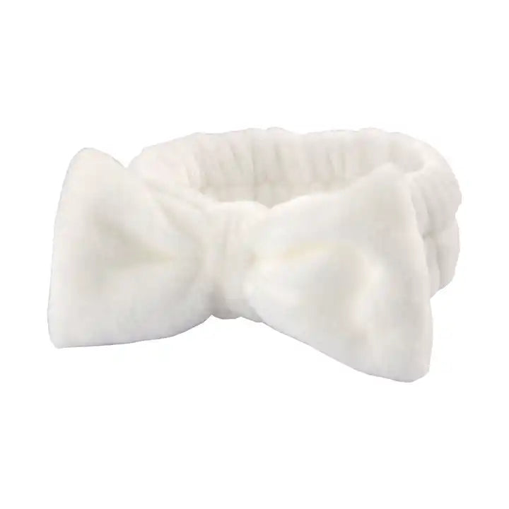 White bow scrunchie on a white background.