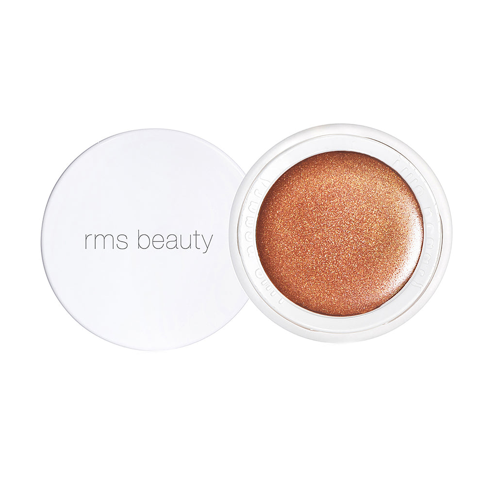 Open container of rms beauty bronzer showing the product inside.