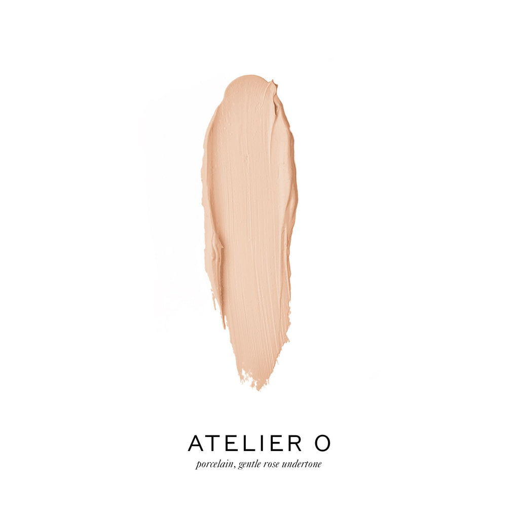 A swatch of porcelain-toned foundation with a gentle rose undertone displayed against a white background.