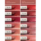 Assortment of lip colors in packaging displayed against a red background.