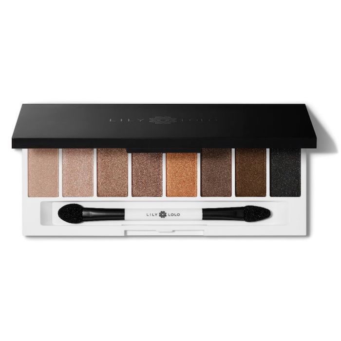 A palette of eyeshadows with various shades and a dual-ended brush.