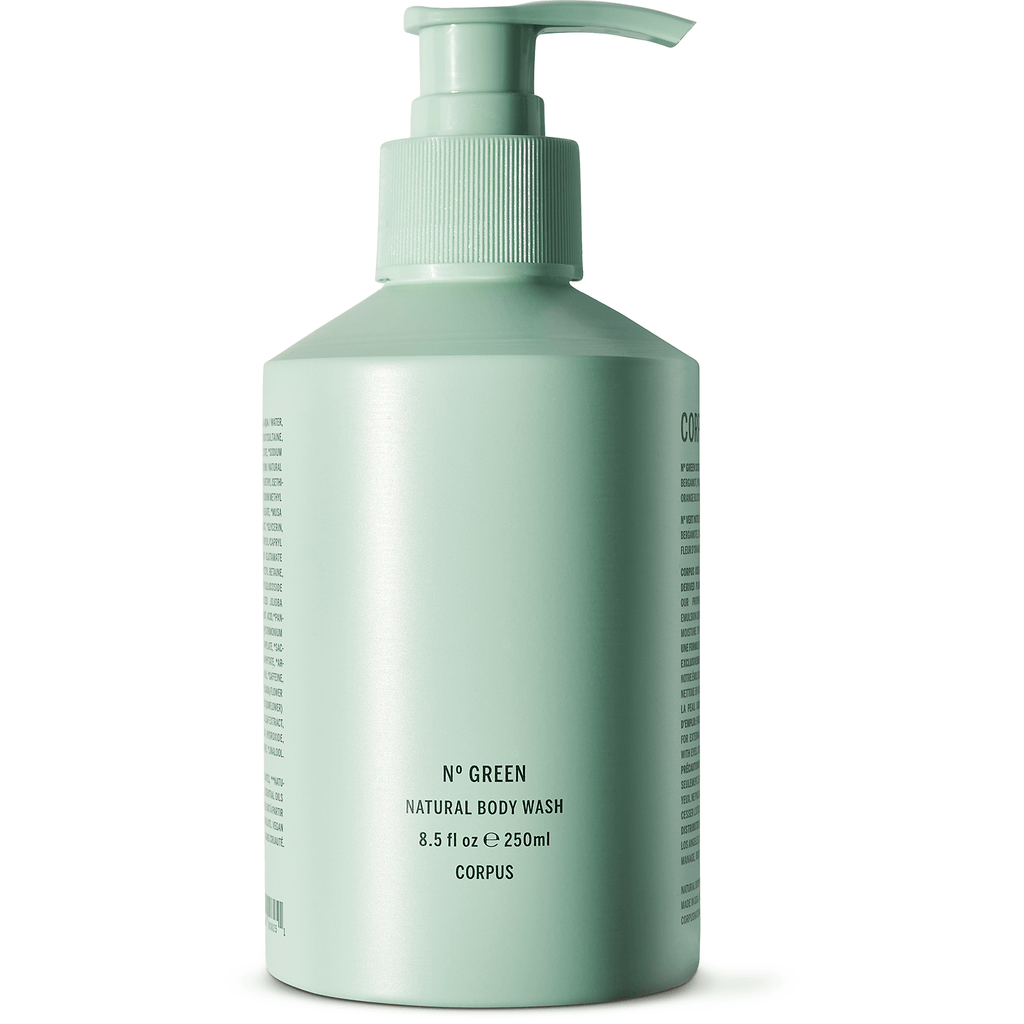 A green bottle of corpus natural body wash with a pump dispenser.