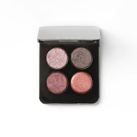 Quartet of shimmering eyeshadows in a compact case.