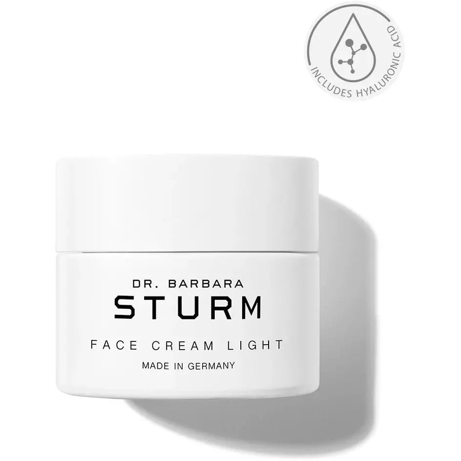 A jar of dr. barbara sturm face cream light with a label specifying it includes hyaluronic acid and is made in germany.