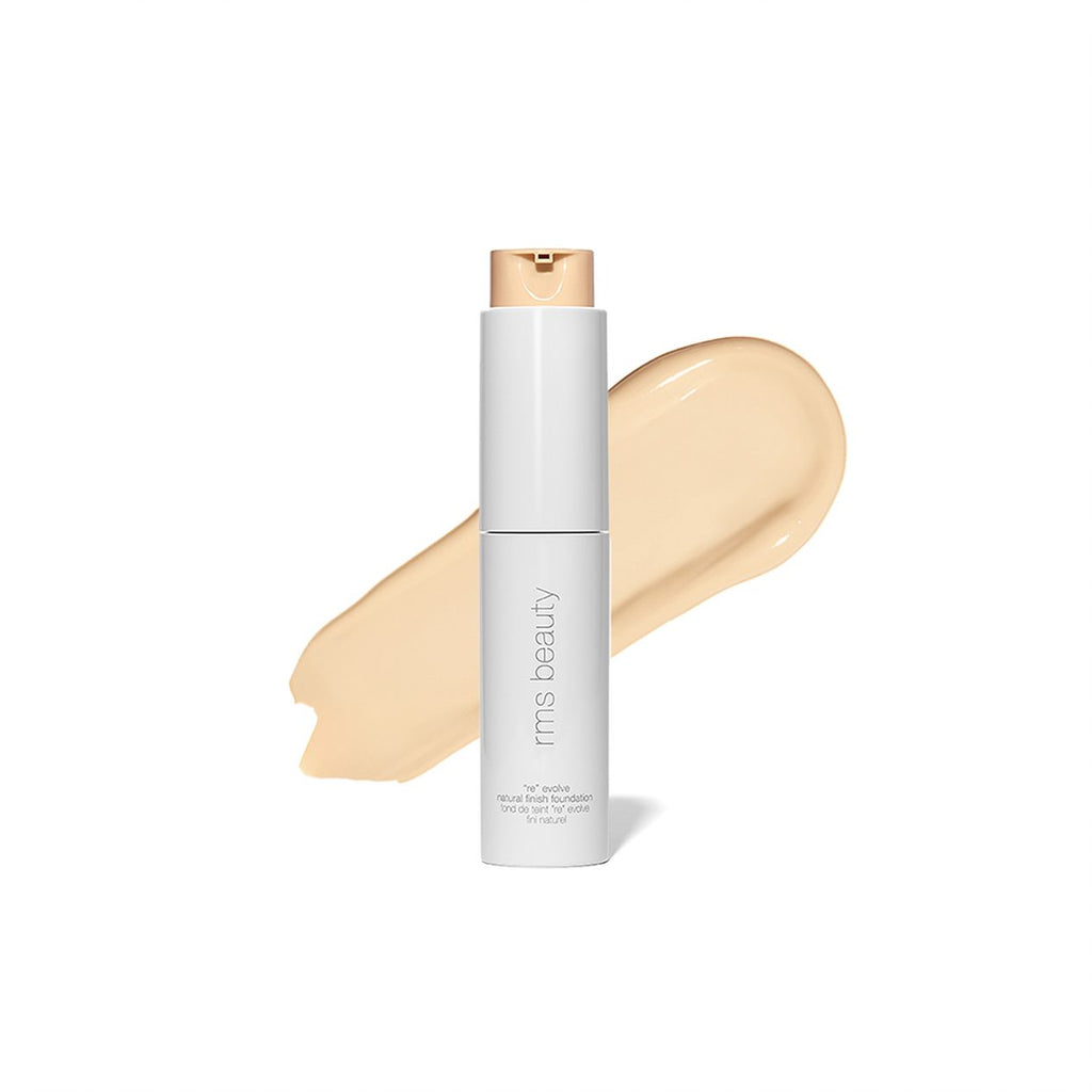 Liquid foundation and container on a white background.