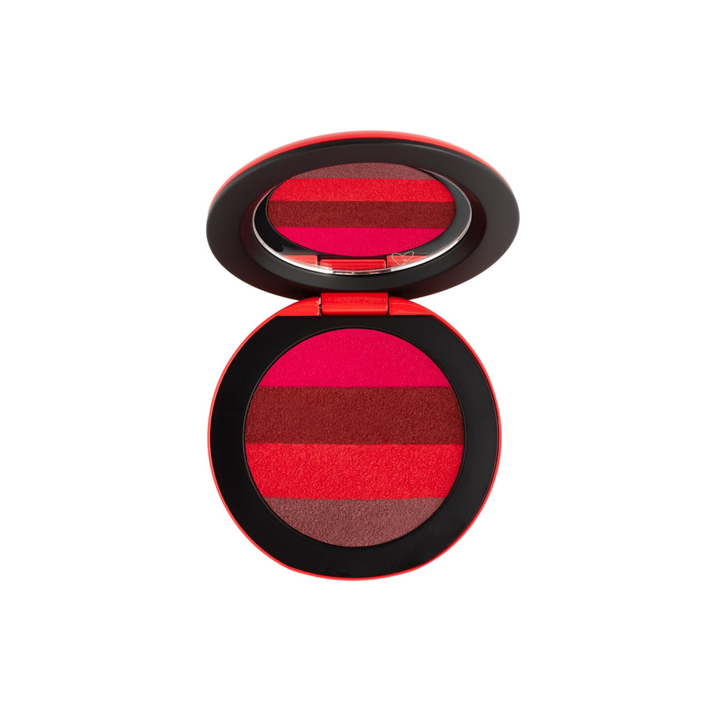 Open compact with an assortment of red-toned blush shades.