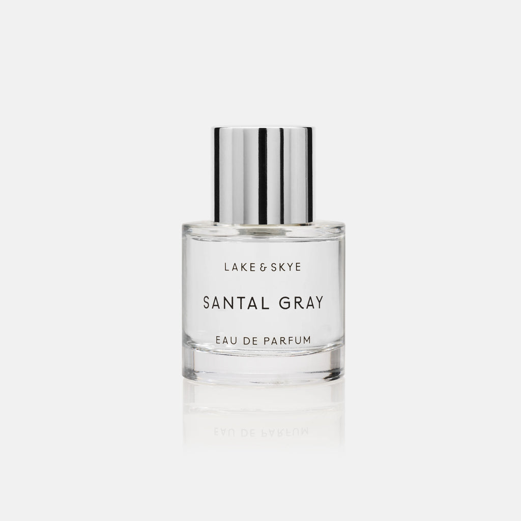 A bottle of lake & skye santal gray eau de parfum against a white background.