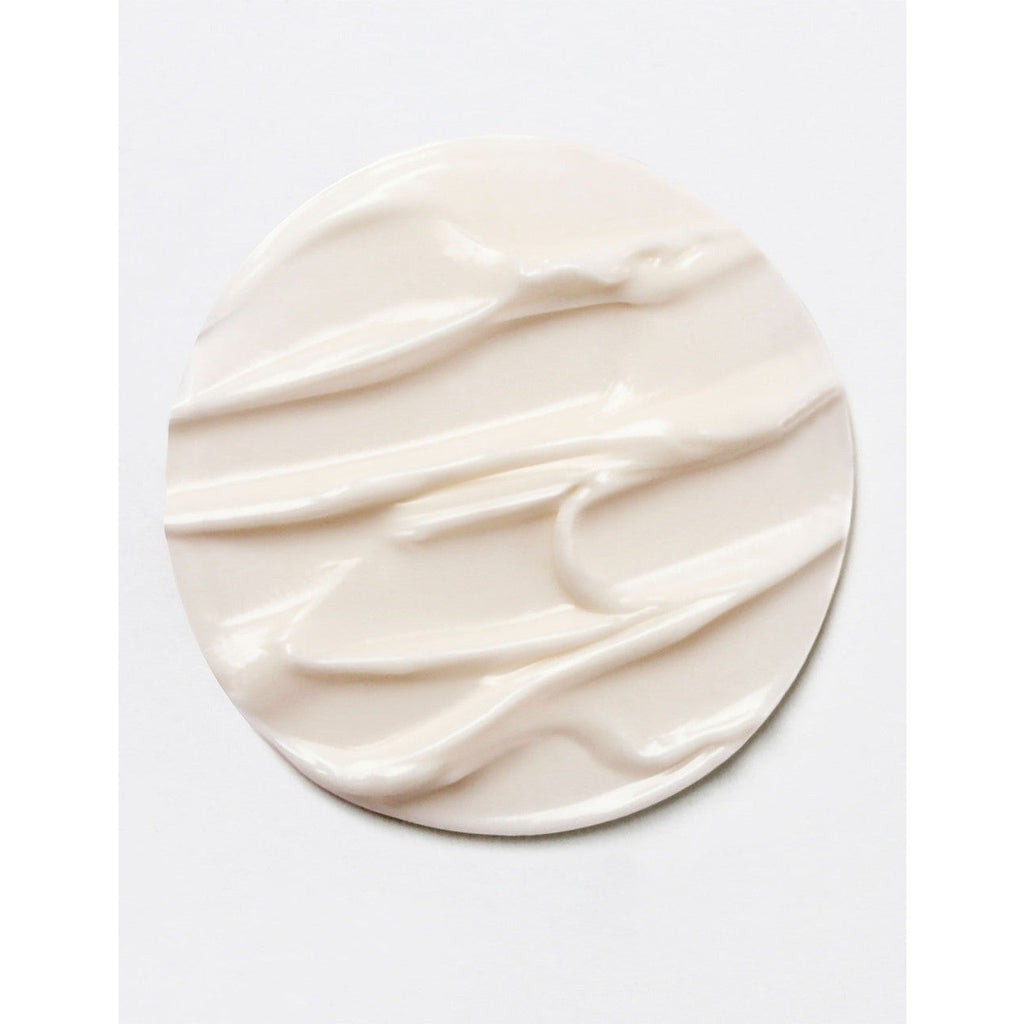 A dollop of creamy substance with a smooth texture against a white background.