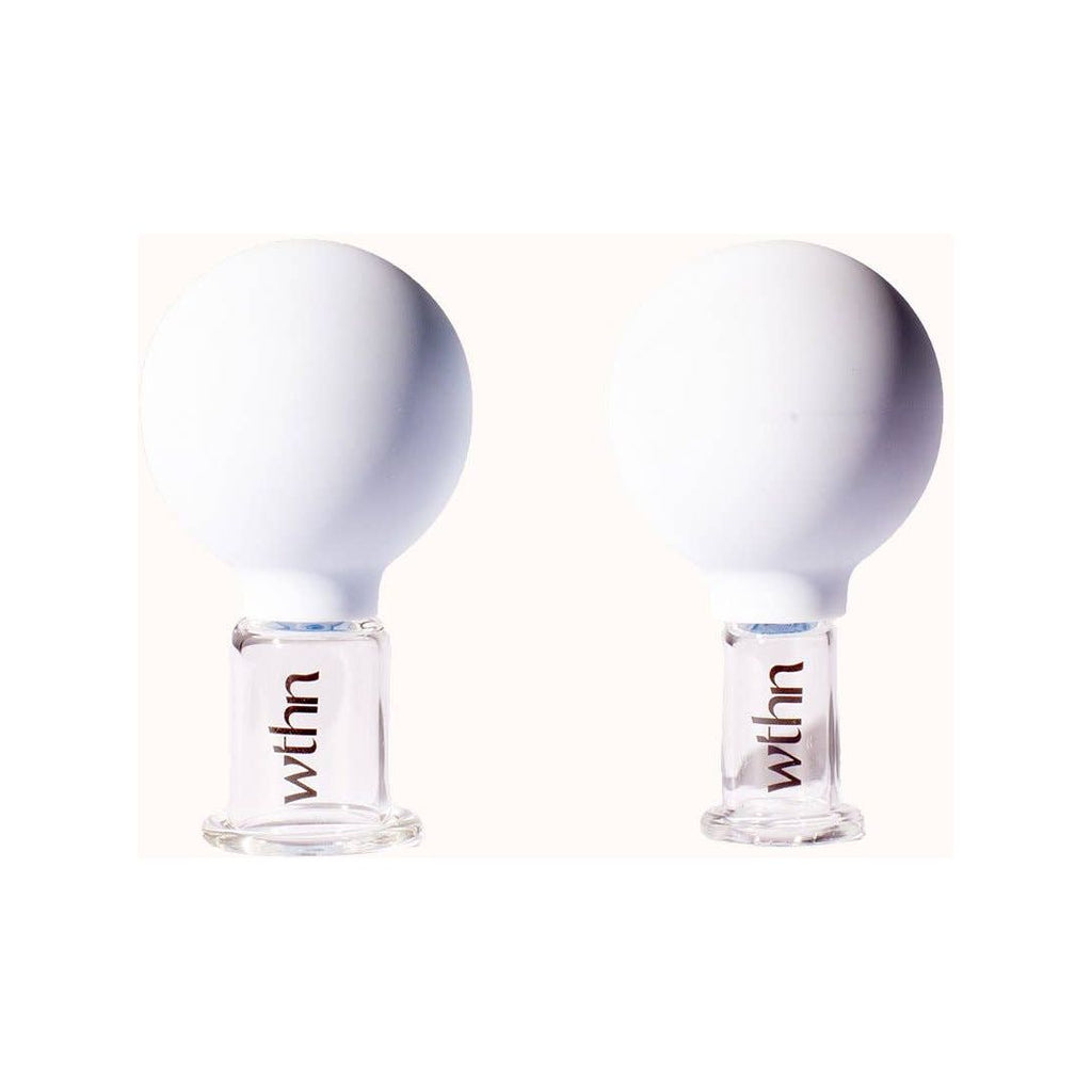 Two light bulbs with the word "with" printed on their transparent bases.