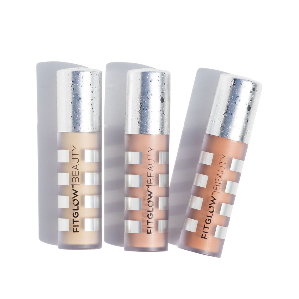 Three tubes of fitglow beauty concealer in various shades against a white background.