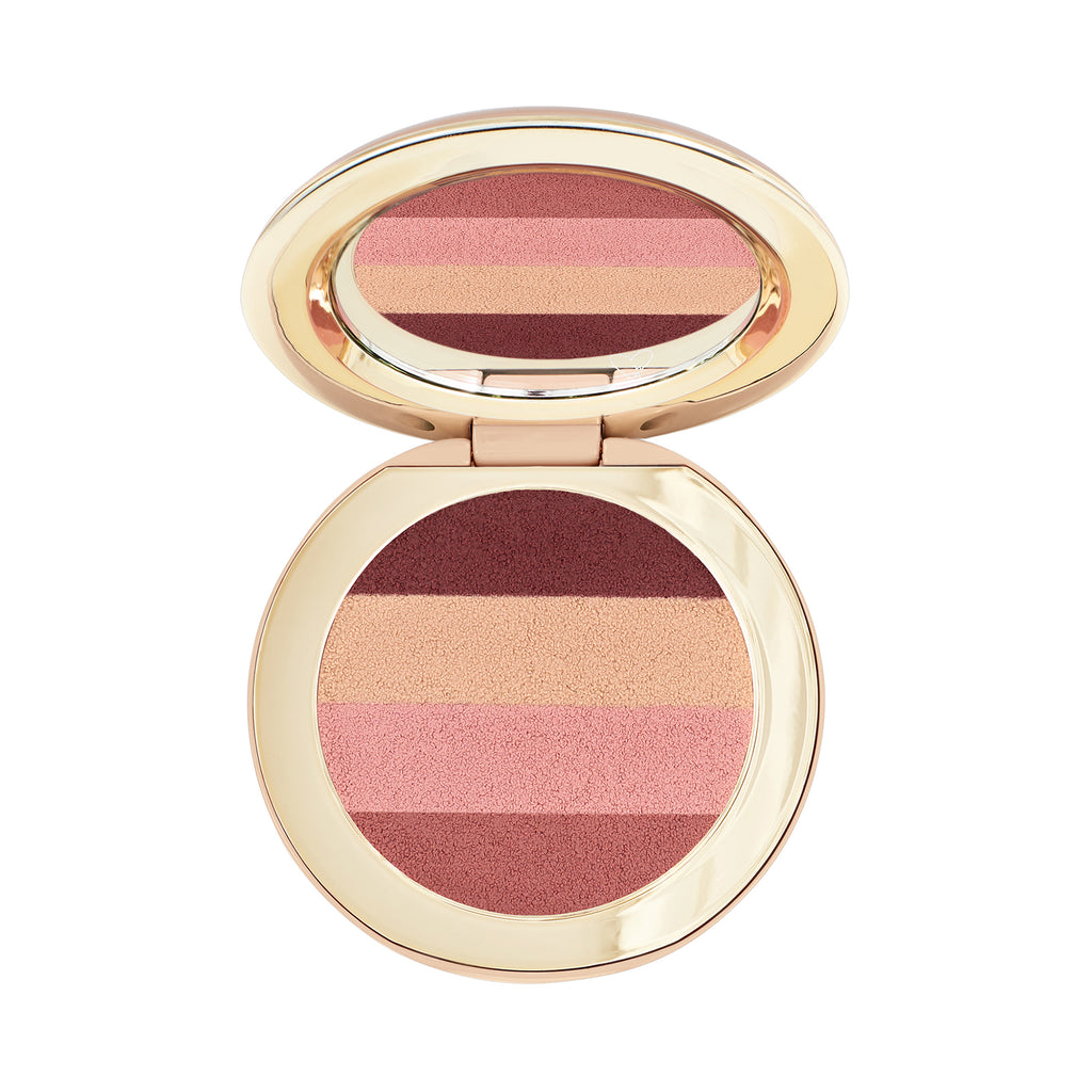Compact blush palette with multiple shades in a golden case.