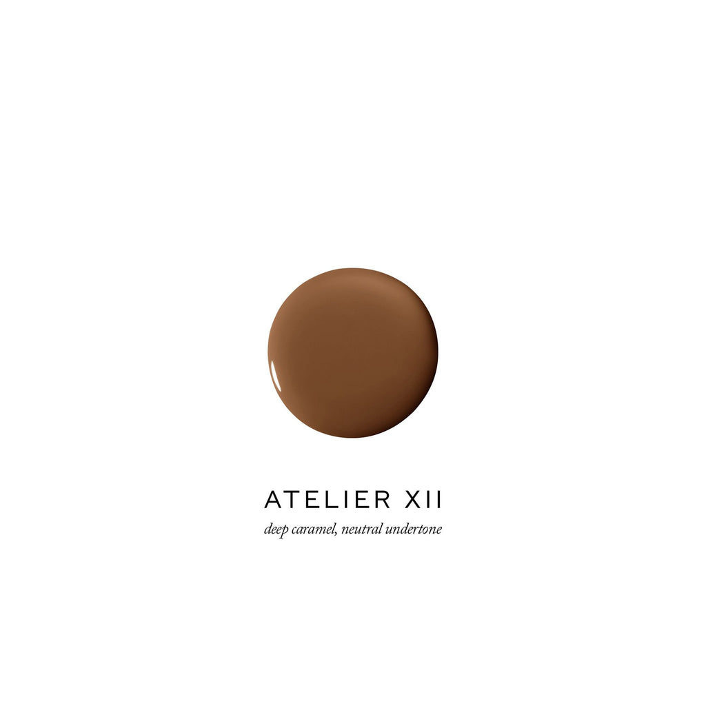A swatch of deep caramel makeup foundation with neutral undertone, labeled "atelier xiii".