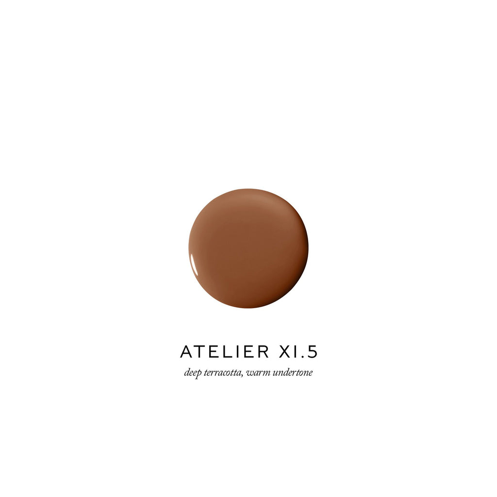 A swatch of deep terracotta makeup foundation with a warm undertone, labeled "atelier xi.5".