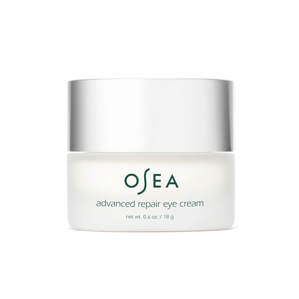 A jar of osea advanced repair eye cream against a white background.