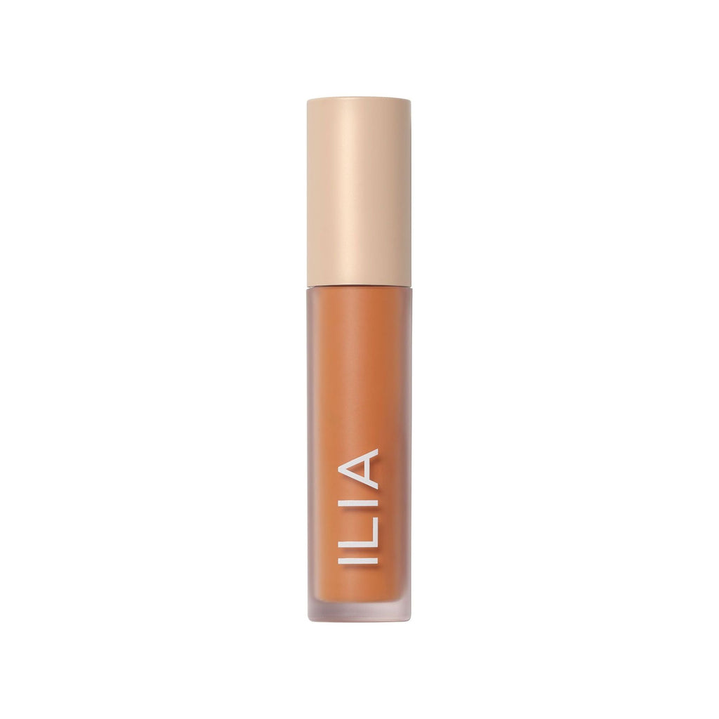 A bottle of ilia brand liquid cosmetic product on a white background.