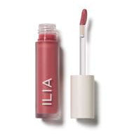 A tube of ilia brand lip gloss with an applicator wand next to it.