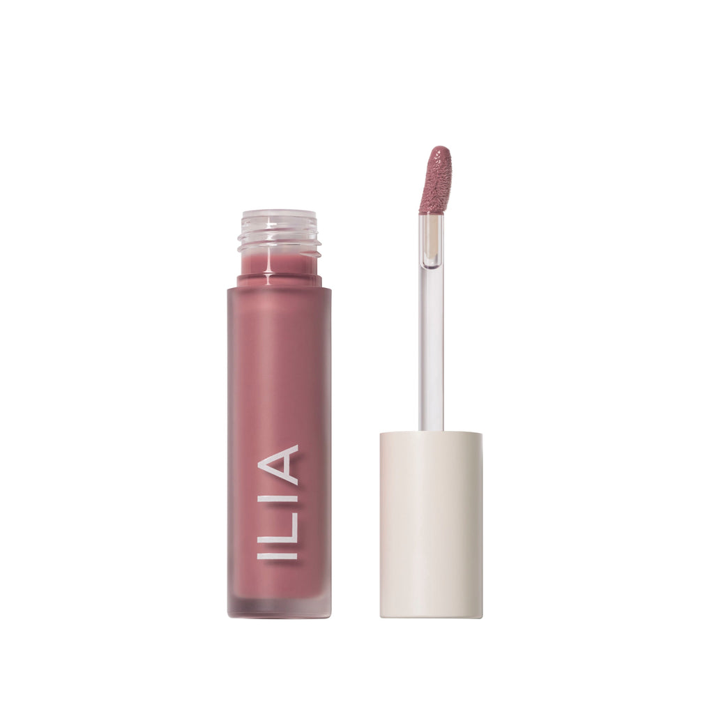 Liquid lipstick with applicator from ilia brand displayed against a white background.