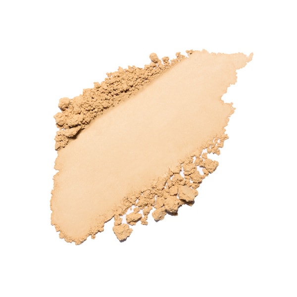 Smudged beige powder makeup on a white background.