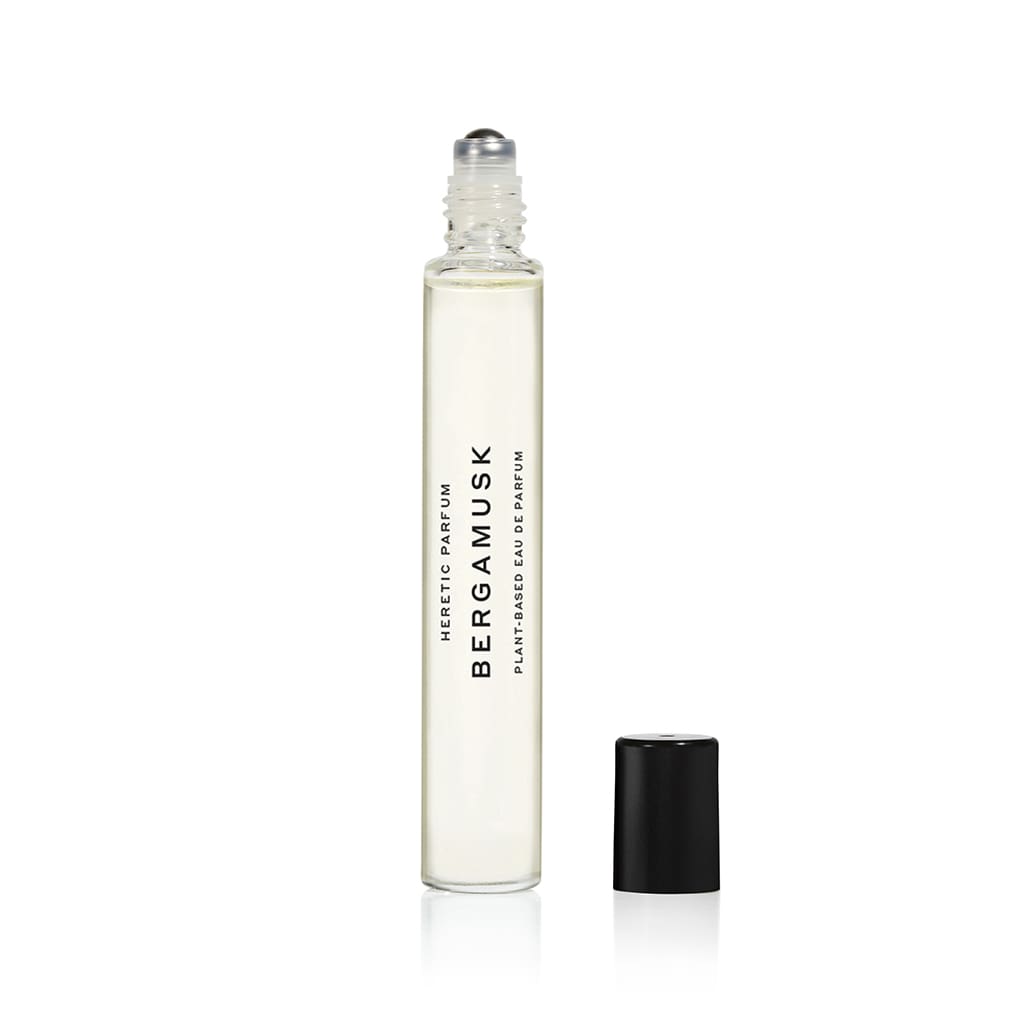 A roll-on bottle of bergamusk perfume oil isolated on a white background.
