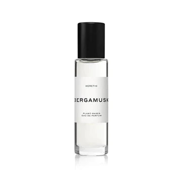 A clear glass perfume bottle with a black cap and a white label that reads "bergamusk" and "plant-based eau de parfum.