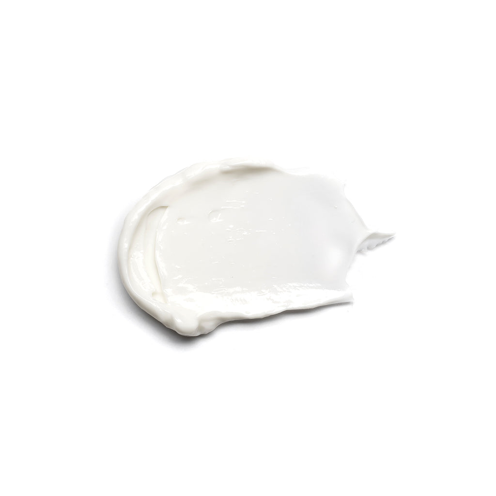 Dollop of white cream on a clean white background.