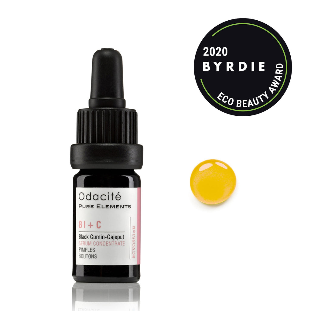 Bottle of odacite black cumin-cajeput serum concentrate with a drop of the product and an award badge for 2020 byrdie eco beauty award.