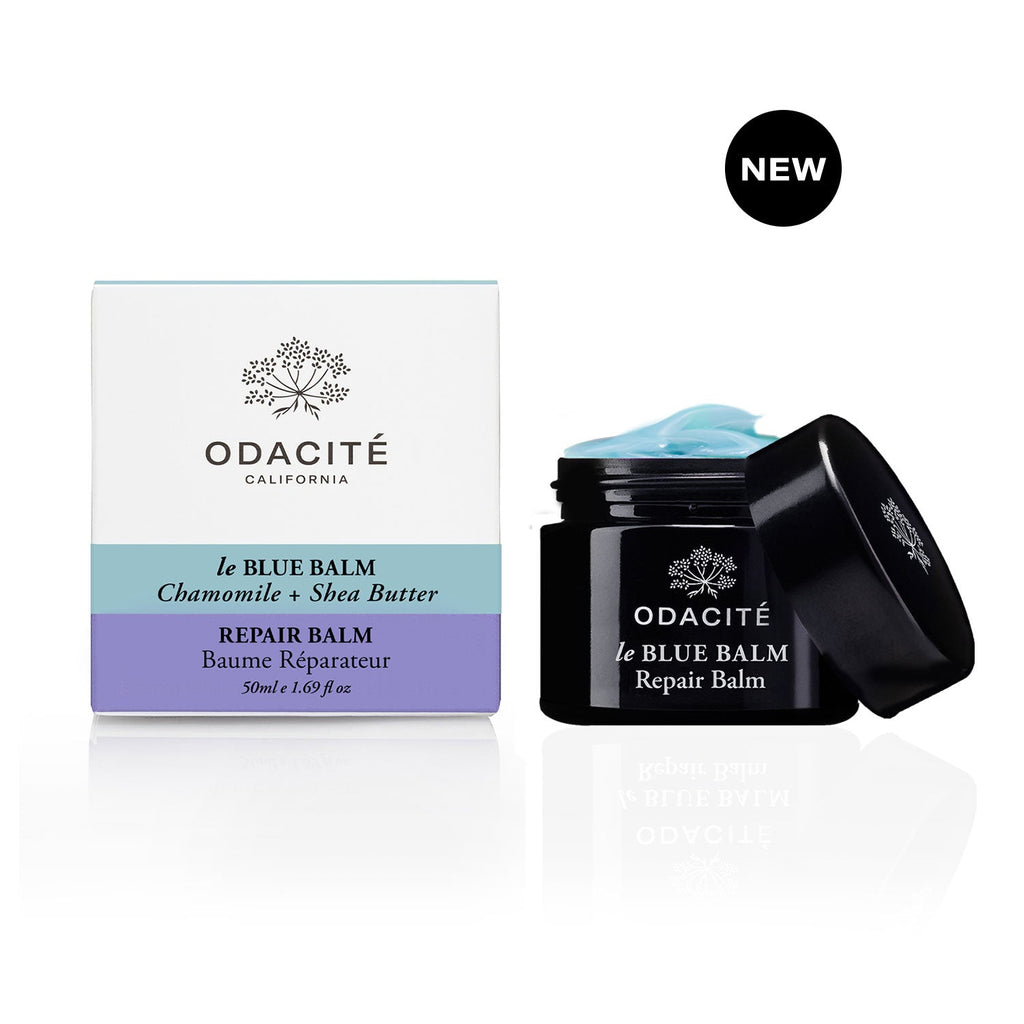 A new odacite le blue balm chamomile and shea butter repair balm with packaging and open container displayed.