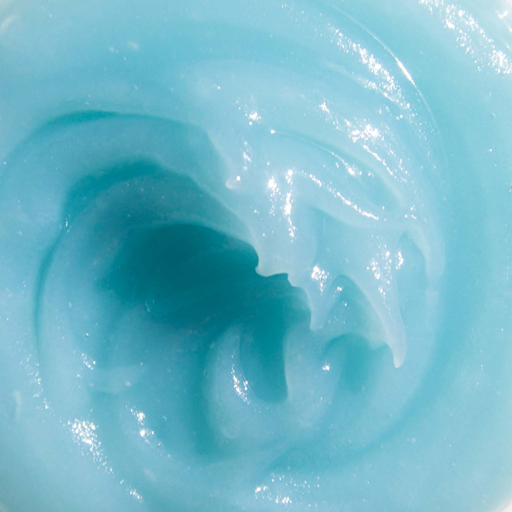 Close-up view of a smooth, blue gel-like substance with a swirling pattern.