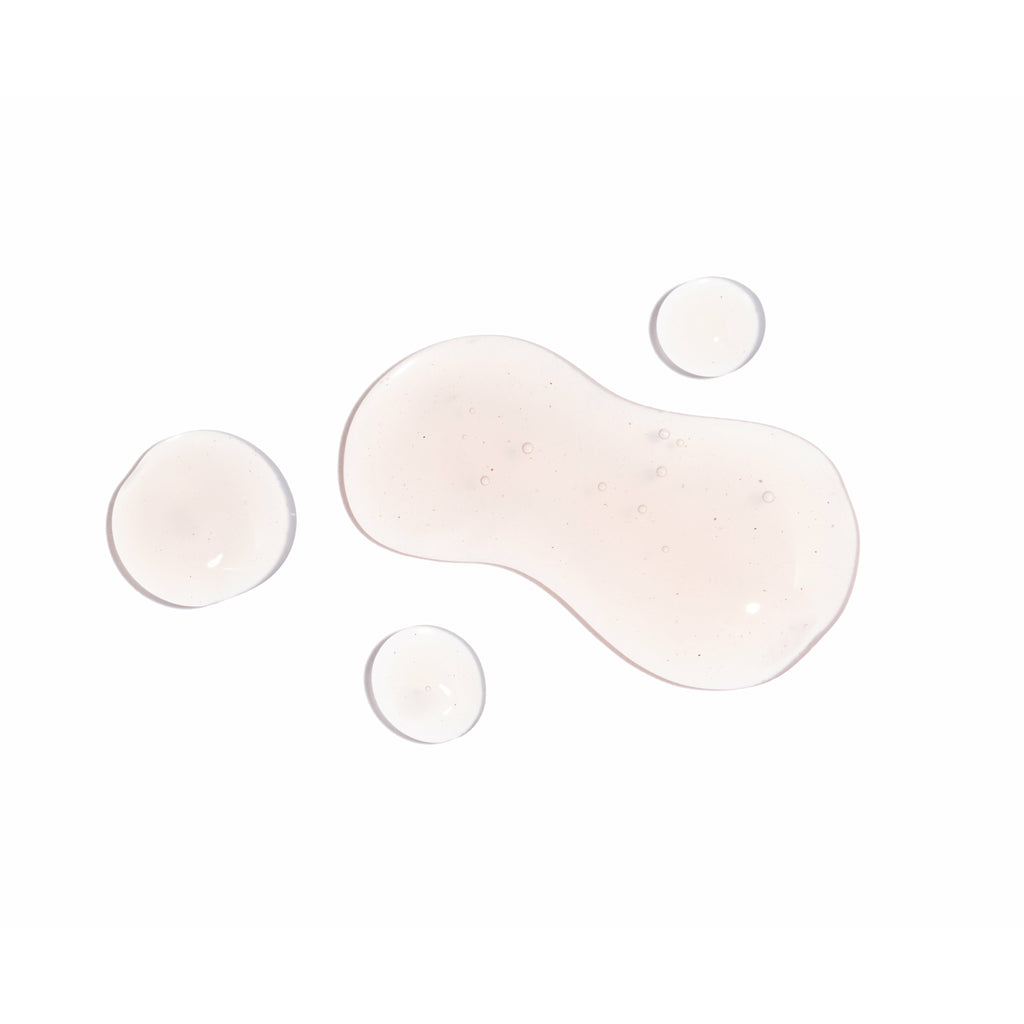 Spilled liquid with bubbles isolated on a white background.