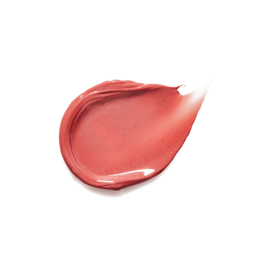 A smear of red lipstick on a white background.