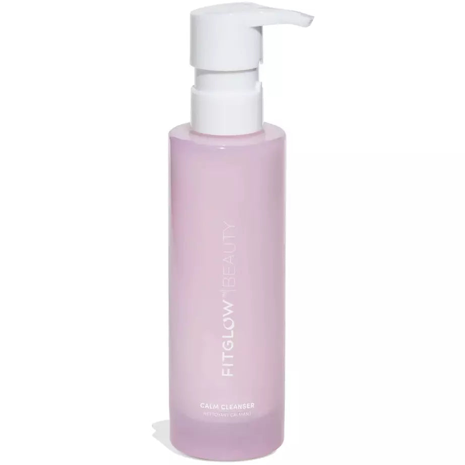 A bottle of fitglow beauty calm cleanser with a pump dispenser on a white background.