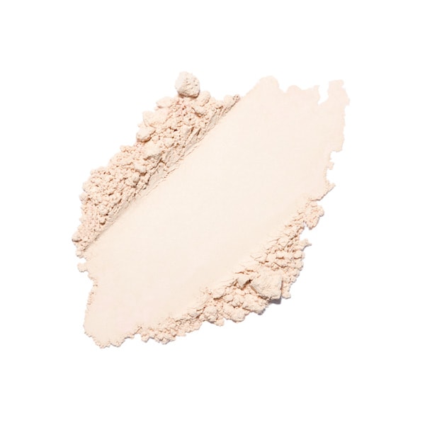 A swatch of crushed compact powder makeup on a white background.